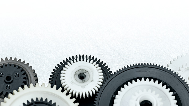 A zoomed in image of a group of black and white gears